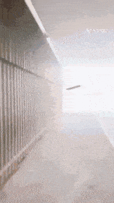 a very long hallway with a vita logo on the ceiling