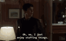 Stuffing Things Bates Motel Norman Funny Smile GIF - Stuffing Things Bates Motel Norman Funny Smile GIFs