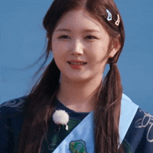 a girl with pigtails is wearing a shirt that says scout on it