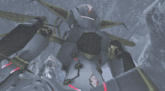 a gray and gold robot with the letters x and y on it
