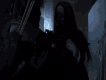 a woman in a black leather jacket holds a bow and arrow