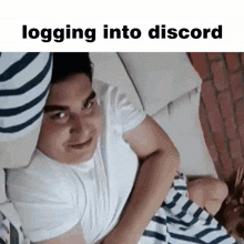 a man is laying on a couch with the words logging into discord on the bottom