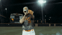 a baseball player wearing a gray shirt with the number 79 on it