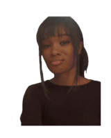 a woman in a black shirt looks at the camera with a smile on her face