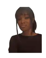a woman in a black shirt looks at the camera with a smile on her face