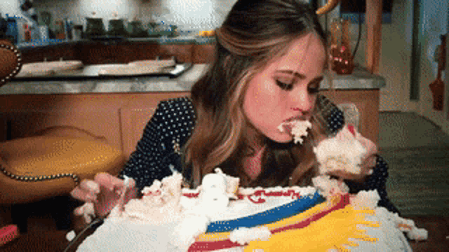 Girl eating her birthday cake stock photo