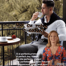 a man sitting on a balcony drinking a cup of coffee and reading a newspaper next to a woman