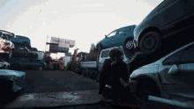 a stack of cars sits in front of a container that says cooks-ltd