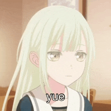 a girl with a straw in her mouth and the word yue on her face