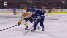 a hockey game is being played with the sn logo in the corner