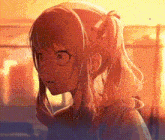 a close up of a girl 's face with a ponytail .