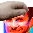 a hand is holding a hat over a man 's head .