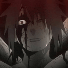 a close up of a person 's face with a bloody eye and a tear coming out of it .