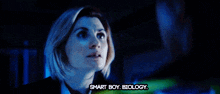 a woman says smart boy biology in a dark room