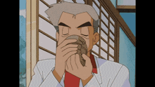 a man in a white suit and red tie is drinking from a cup