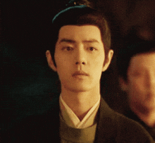 a close up of a man 's face with a crown on his head