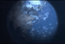 a close up of a planet in space with a dark background
