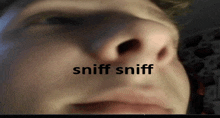 a close up of a person 's nose with the words sniff sniff written below it