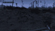 a blurred image of a video game with a green arrow pointing to the bottom right corner