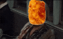 a woman with a fried chicken nugget on her face