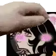 a close up of a person 's hand holding a picture of a girl with pink cheeks .