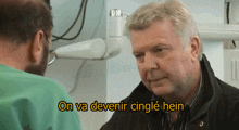 a man talking to another man with the words on va devenir cingle hein in the corner