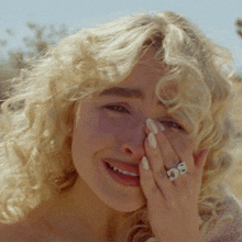 a woman with a ring on her finger that says ' sg '
