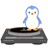 a penguin is standing on top of a record player