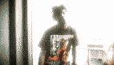 a blurry picture of a man wearing a t-shirt that says ' nirvana '