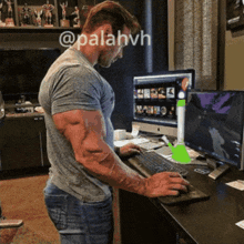 a man with huge muscles is using a computer with the hashtag @palahvh on the bottom