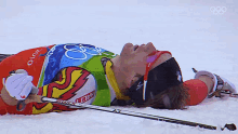 tired winter olympics2022 laying on the snow exhausted fast breathing