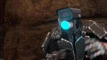 a robot with a camera on its head says you 're in white letters