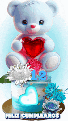 a teddy bear is holding a heart on top of a birthday cake with the number 12 on it