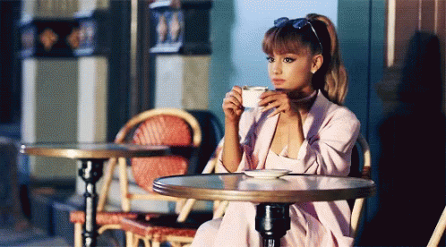 Ariana Grande Sips Coffee GIF - Ariana Grande Sips Coffee Chillin - Discover & Share GIFs