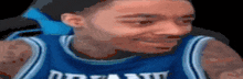 a blurry picture of a person wearing a blue jersey that says orlando