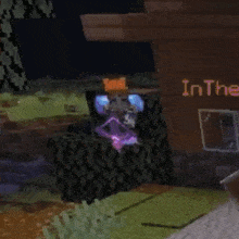 a person in a minecraft game is holding a purple object