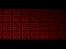 a red background with a black border and a pattern on it