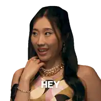 a woman with braces on her teeth says " hey "