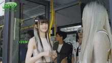 a group of people on a bus with making jeans written on the top