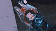 a close up of a robotic arm holding a card