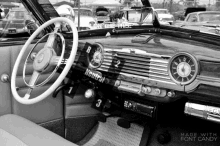 a black and white photo of the interior of an old car with the words made with font candy