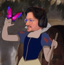 a man wearing headphones and glasses is holding a butterfly