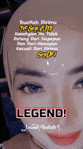 a woman wearing a hijab with the words legend written on it