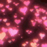 a bunch of pink hearts floating in the air on a dark background