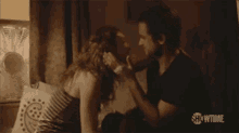 a man and a woman are kissing on a bed with showtime written on the bottom