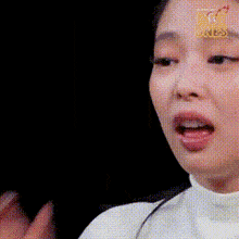 a close up of a woman sticking her tongue out while making a funny face .