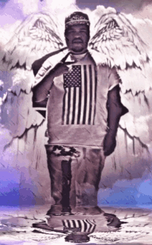 a man wearing an american flag t-shirt with wings
