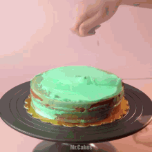 a cake on a black plate with the word mr.cakes on the bottom