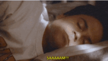 a person laying in bed with the words saaaaam on the bottom right