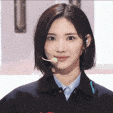 a woman with a microphone in her mouth